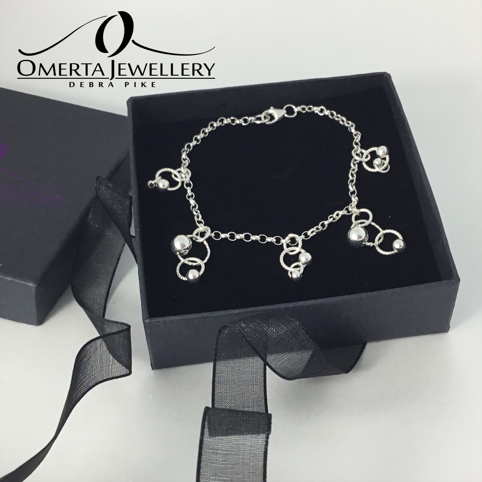 Sterling Silver Chain Bracelet With Orbital Charms